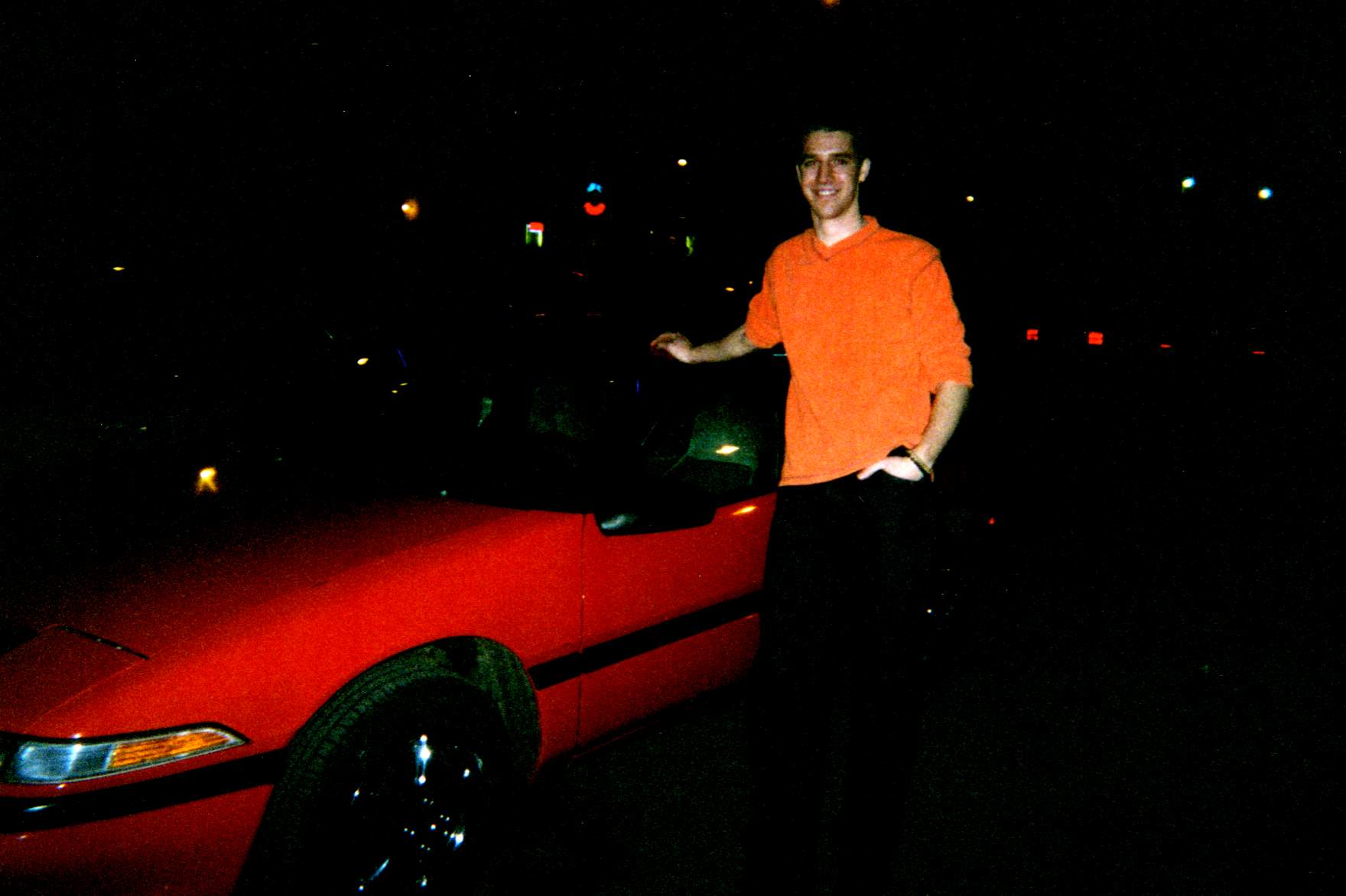me in front of my car